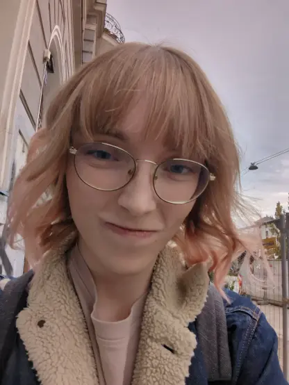Another selfie, this time outside with my wearing a denim jacket with sherpa. I'm squinting my eyes, giving a slightly mean look.