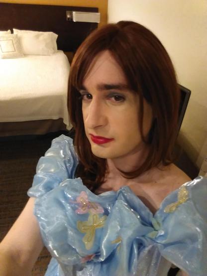 A selfie of a crossdresser in a Cinderella costume